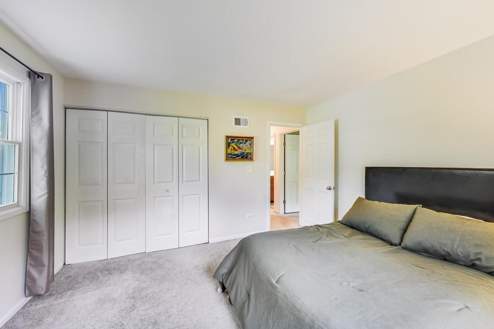 2210 Freeman Court Inverness, IL 60067 - Photo 31 of 56 a bedroom with a large bed and a shower