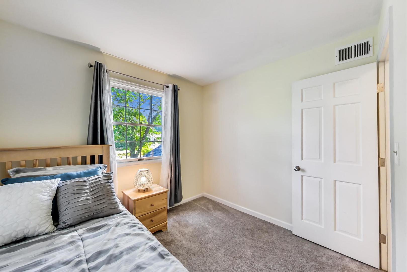 2210 Freeman Court Inverness, IL 60067 - Photo 39 of 56 a bedroom with a large bed and a window