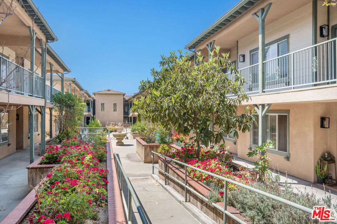 1128 West Duarte Road, Unit A Arcadia, CA 91007 - Photo 24 of 28 a bunch of flowers in front of a house