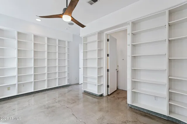 a view of an empty room with a empty shelves