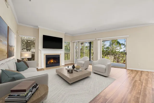 a living room with furniture fireplace and a flat screen tv
