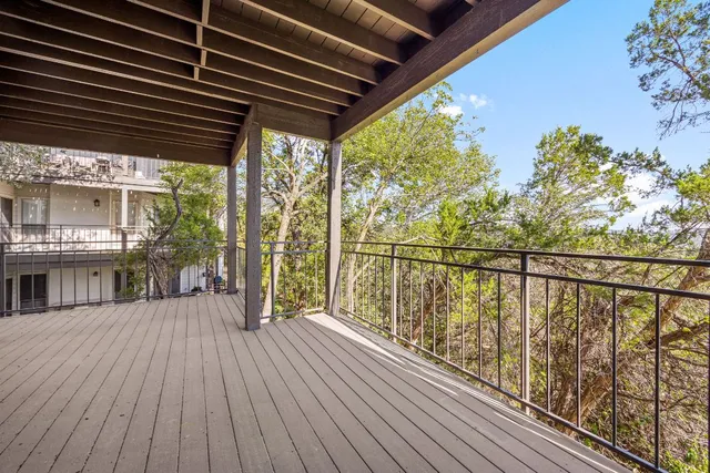 a view of a balcony with wooden floor