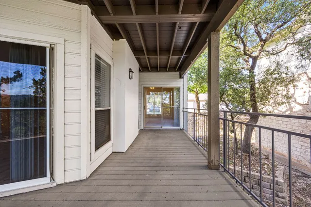 a view of a porch with wooden floor and outdoor space