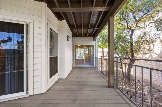 a view of a porch with wooden floor and outdoor space