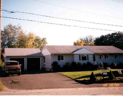 63 David Humphrey Road Derby, CT 06418 - Photo 1 of 1 a front view of a house with parking space