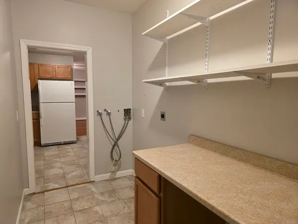 a bathroom with a tub and shower