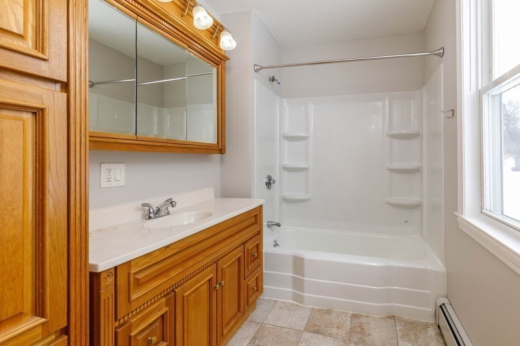 184 Minott Road, Unit 1 Gardner, MA 01440 - Photo 6 of 13 a bathroom with a tub and shower
