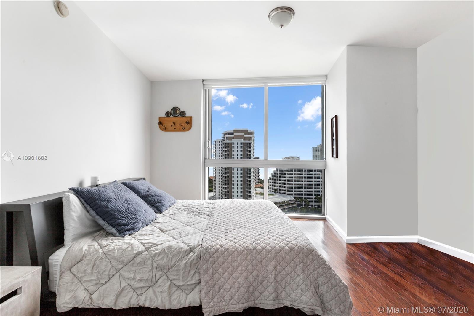 495 Brickell Avenue, Unit 1802 Miami, FL 33131 - Photo 12 of 30 a bedroom with a bed and a window