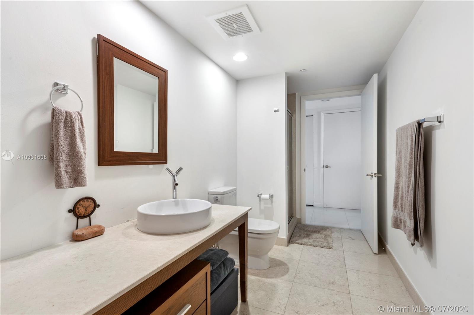 495 Brickell Avenue, Unit 1802 Miami, FL 33131 - Photo 13 of 30 a bathroom with a sink and a mirror