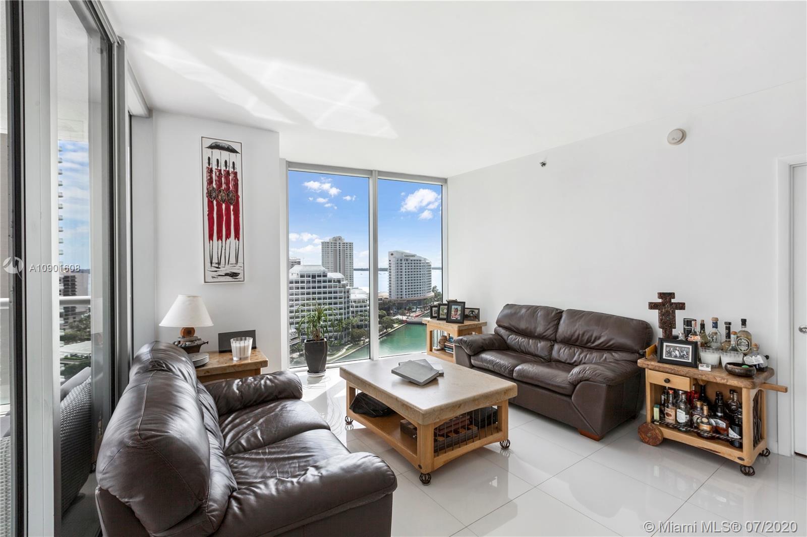 495 Brickell Avenue, Unit 1802 Miami, FL 33131 - Photo 8 of 30 a living room with furniture ceiling fan and a window