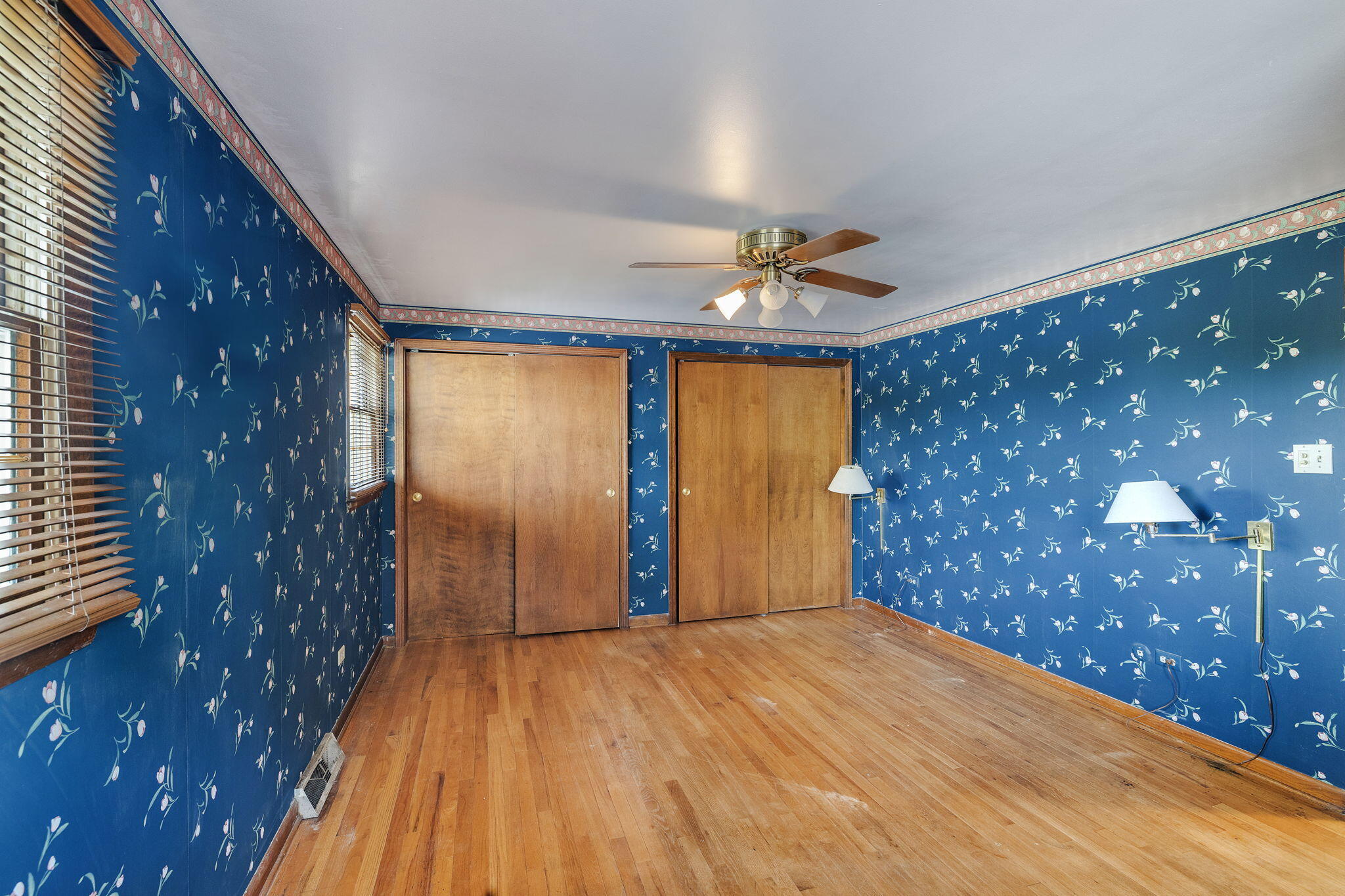 218 West 38th Court Griffith, IN 46319 - Photo 14 of 23 a view of empty room with wooden floor and fan