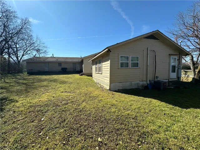 a house view with a garden space