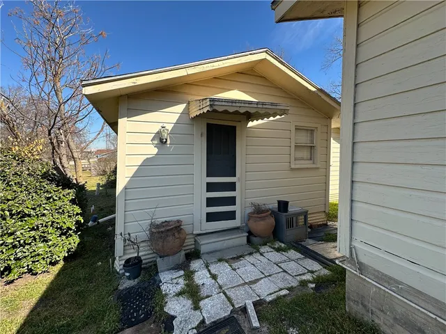 a front view of a house with seating space