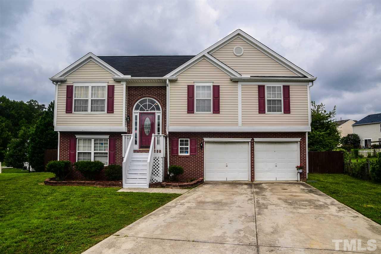 5600 Orchard Gate Way Raleigh, NC 27616 - Photo 1 of 19 a front view of a house with a yard and garage