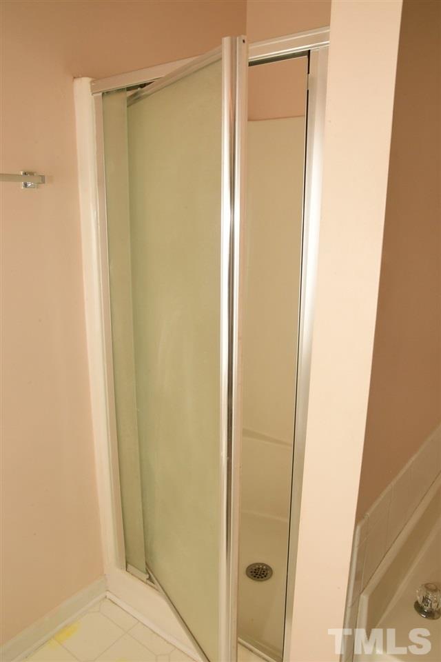 5600 Orchard Gate Way Raleigh, NC 27616 - Photo 14 of 19 a bathroom with a glass door shower