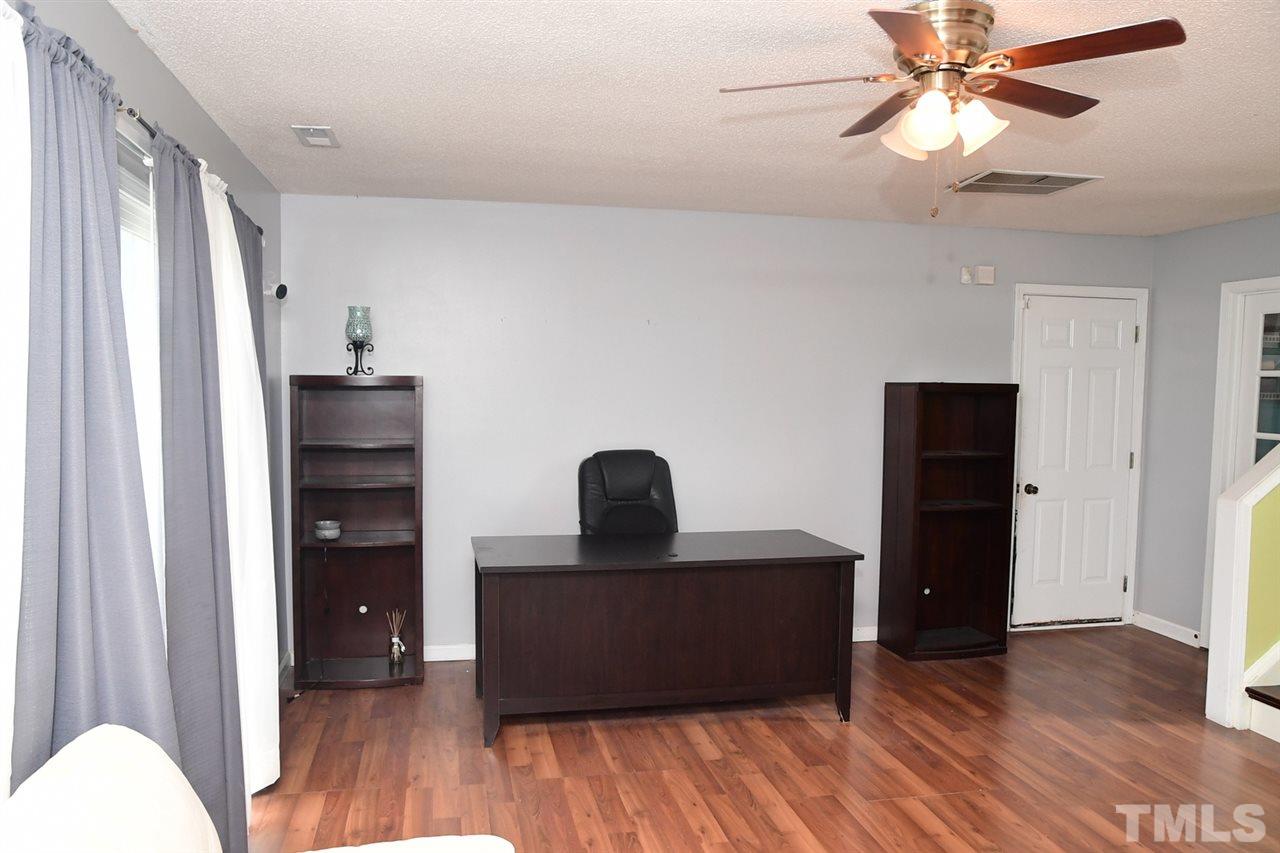 5600 Orchard Gate Way Raleigh, NC 27616 - Photo 17 of 19 a bedroom with a bed and a dresser