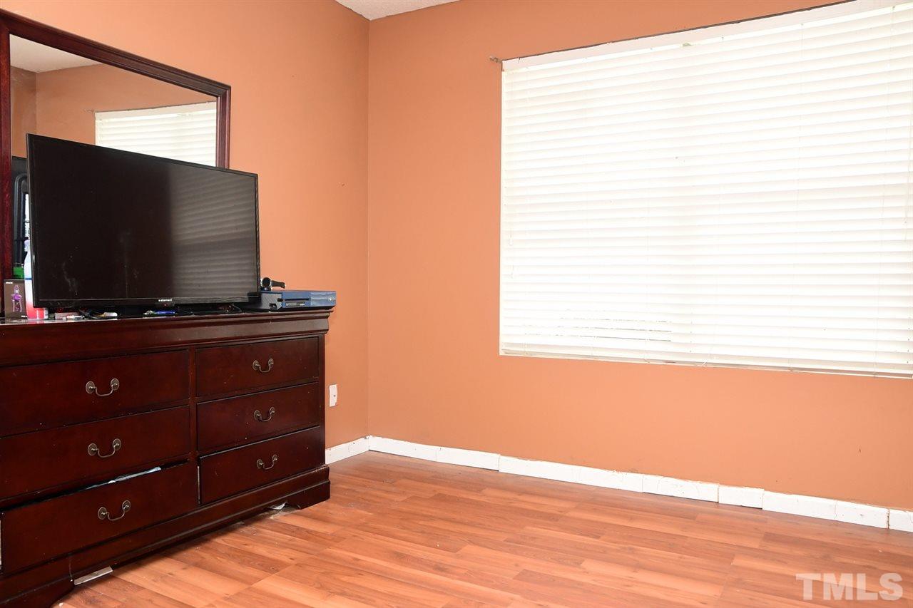 5600 Orchard Gate Way Raleigh, NC 27616 - Photo 18 of 19 a room with a flat screen tv and a window
