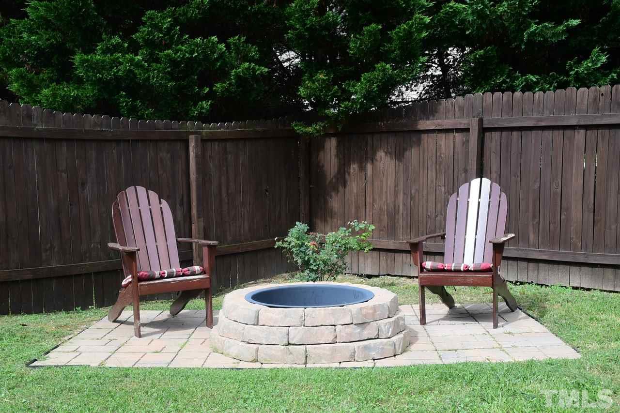 5600 Orchard Gate Way Raleigh, NC 27616 - Photo 3 of 19 a view of a chair and table in backyard of the house