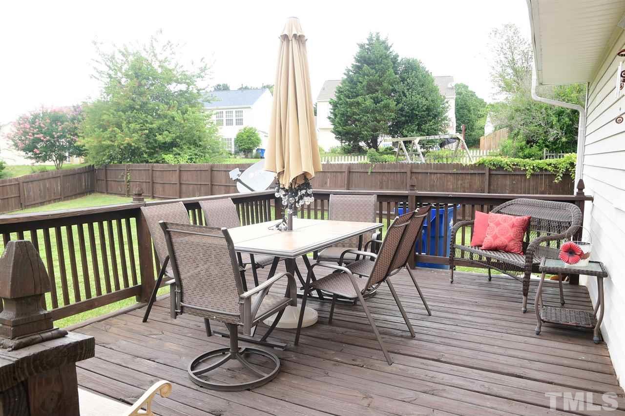 5600 Orchard Gate Way Raleigh, NC 27616 - Photo 5 of 19 a view of a patio with a dining table and chairs with wooden floor