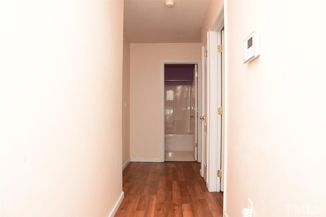 5600 Orchard Gate Way Raleigh, NC 27616 - Photo 10 of 19 a view of a hallway with wooden floor