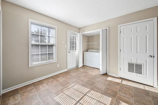 a view of an empty room with a window