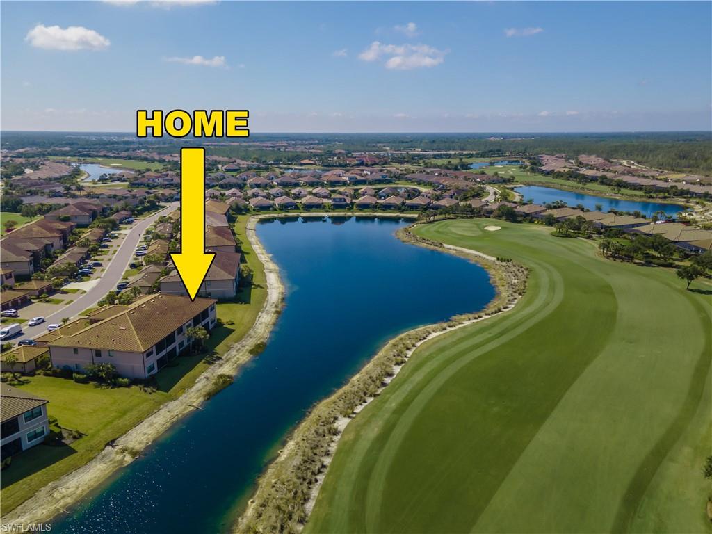 9389 Pocida Court, Unit 202 Naples, FL 34119 - Photo 21 of 38 Aerial view of residential area with a nearby body of water and a golf club