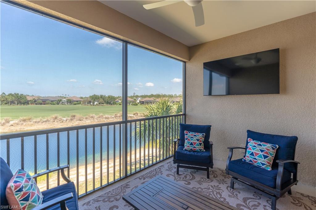 9389 Pocida Court, Unit 202 Naples, FL 34119 - Photo 23 of 38 Sunroom / solarium with a textured wall