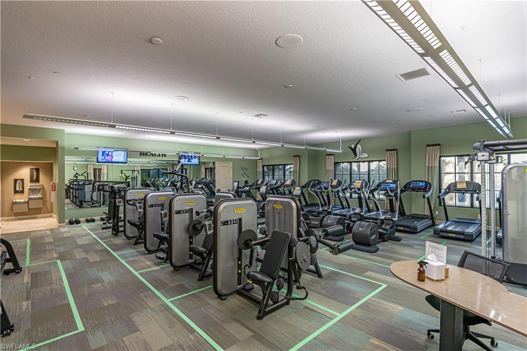 9389 Pocida Court, Unit 202 Naples, FL 34119 - Photo 38 of 38 Workout area featuring a textured ceiling