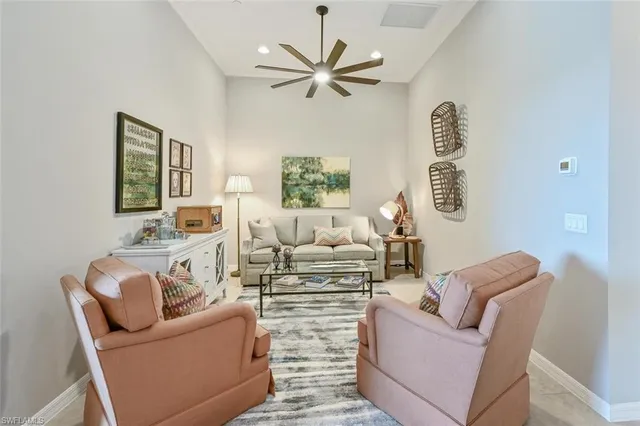 a living room with furniture a bed and a couch