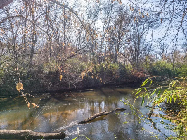 a view of swimming pool with a yard