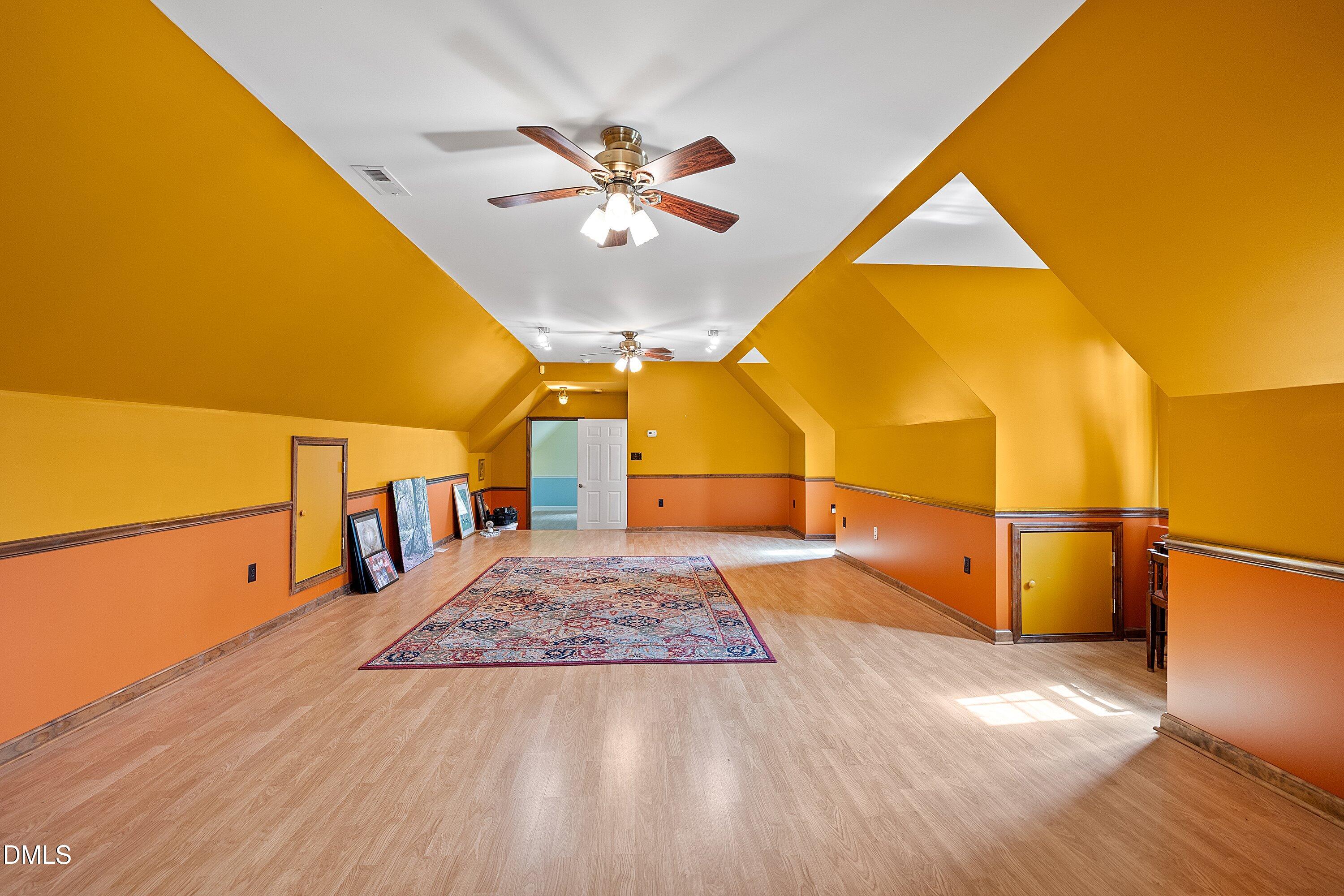 2265 Bud Lipscomb Road Willow Spring, NC 27592 - Photo 38 of 76 a view of a room with wooden floor and windows