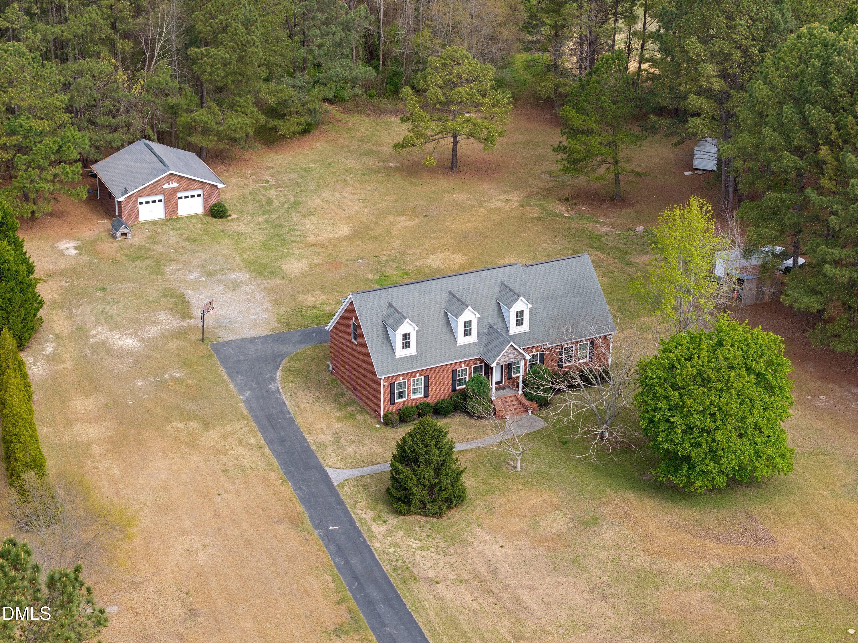 2265 Bud Lipscomb Road Willow Spring, NC 27592 - Photo 71 of 76 an aerial view of a house with outdoor space