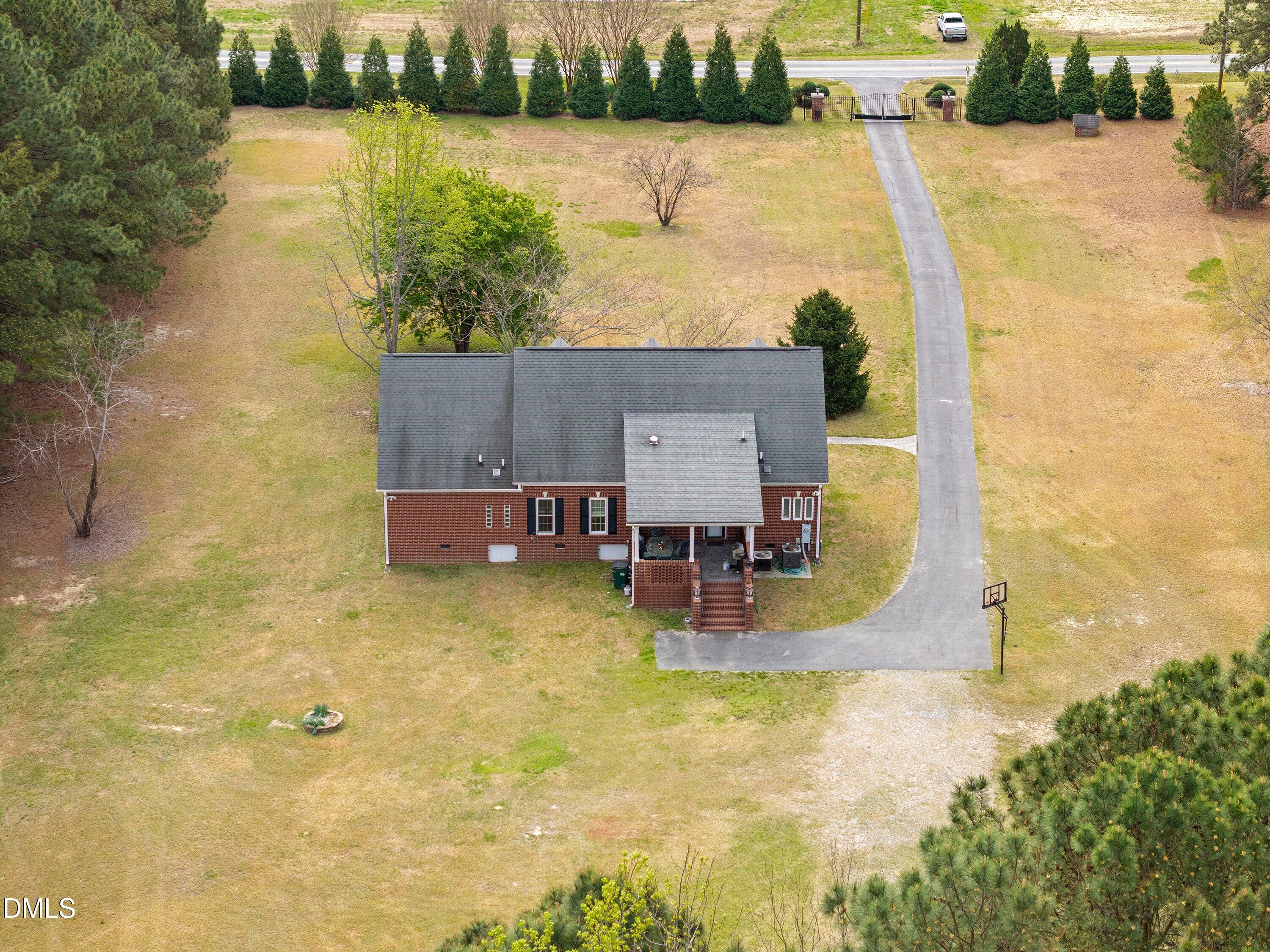 2265 Bud Lipscomb Road Willow Spring, NC 27592 - Photo 73 of 76 a swimming pool with chairs