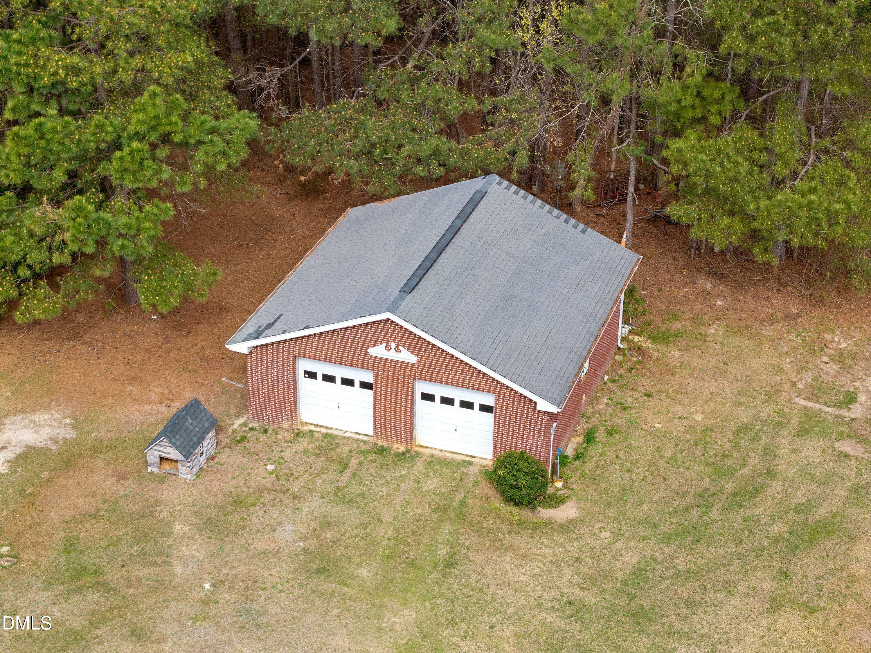 2265 Bud Lipscomb Road Willow Spring, NC 27592 - Photo 74 of 76 a view of a pool with a yard