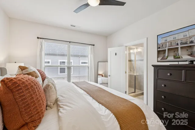 a bedroom with a bed and a dresser