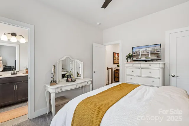 a bedroom with a bed and a dresser