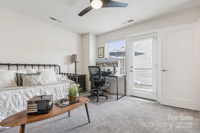 a bathroom with a sink mirror vanity and toilet