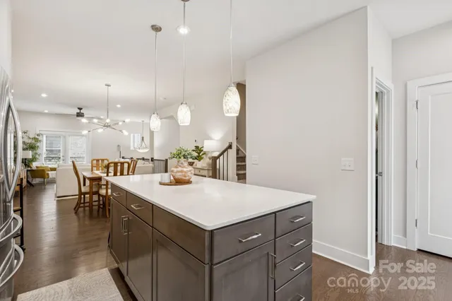 a view of a kitchen counter space and living room