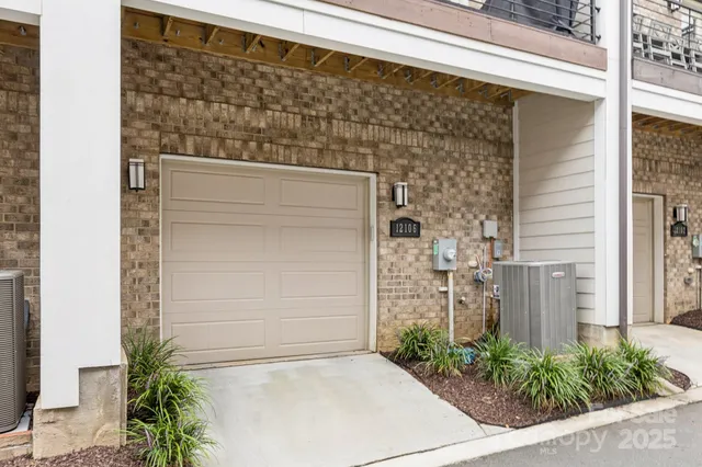 a view of a balcony with chairs and wooden floor