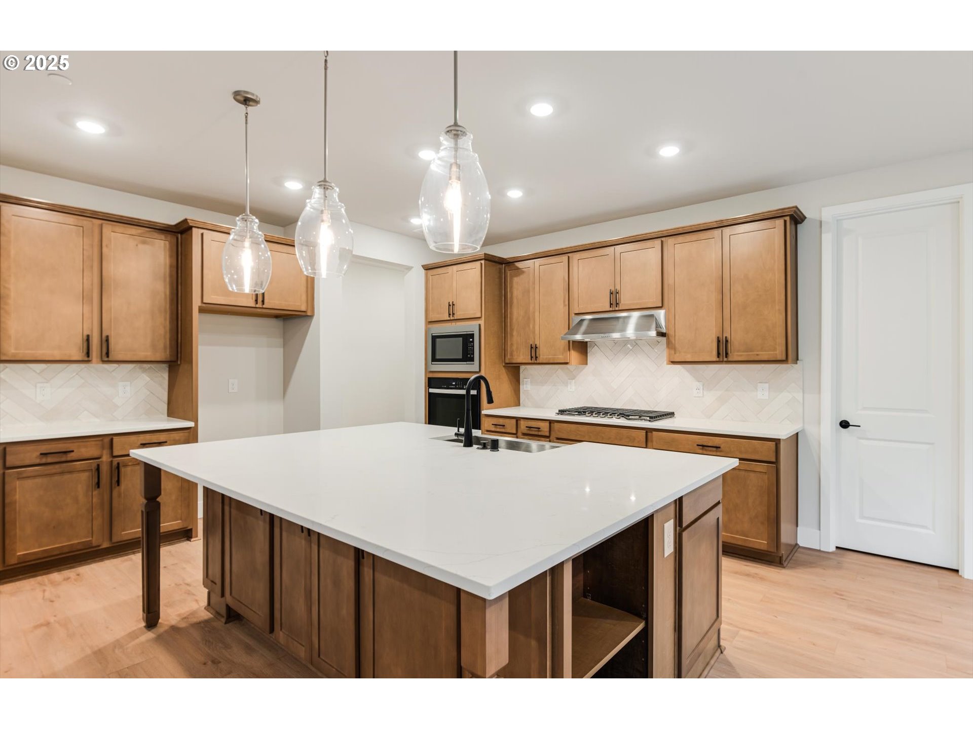 8710 South 3rd Street Ridgefield, WA 98642 - Photo 5 of 22 a kitchen with a stove a refrigerator and a sink