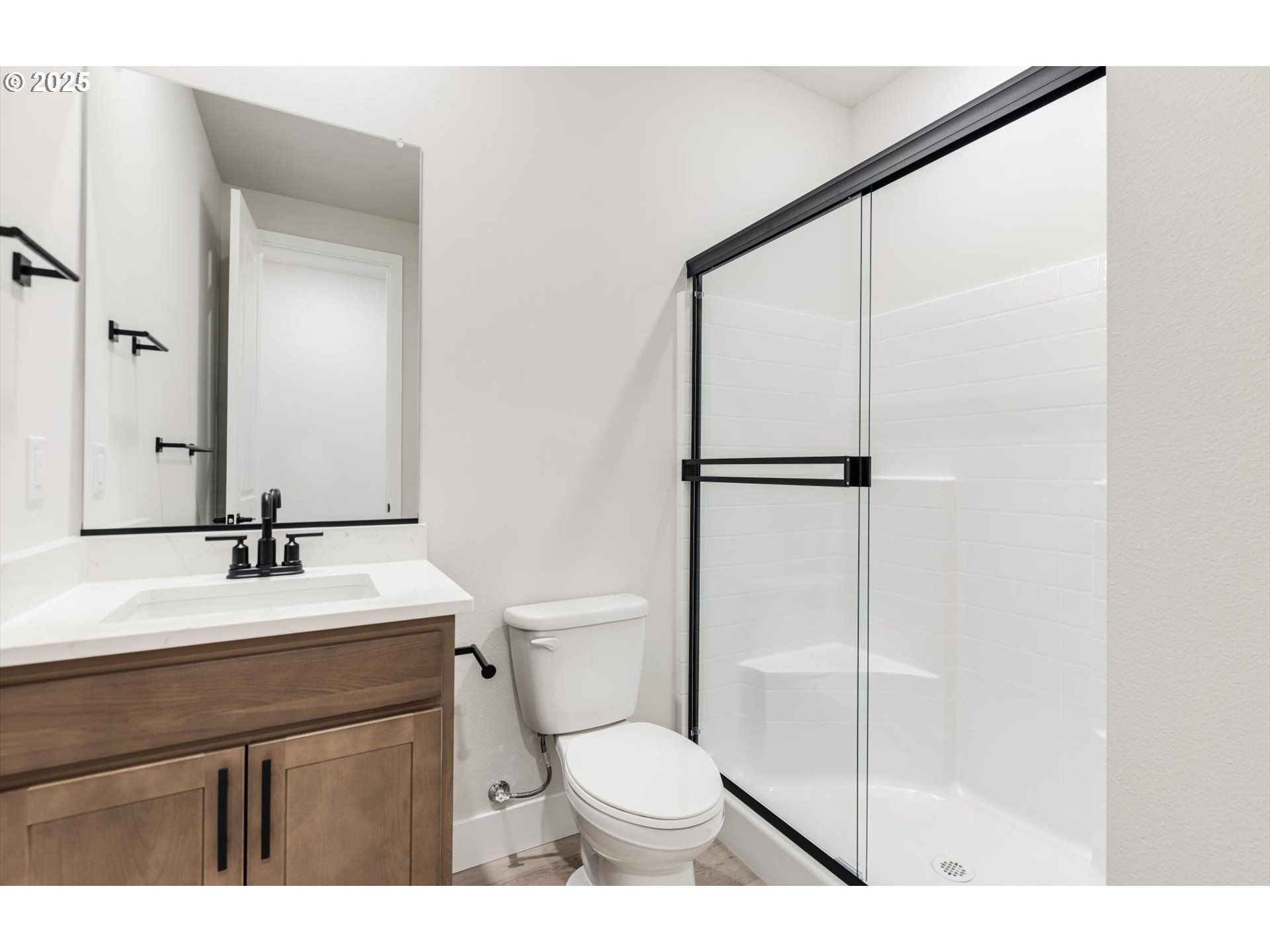 8710 South 3rd Street Ridgefield, WA 98642 - Photo 10 of 22 a bathroom with a sink toilet and shower