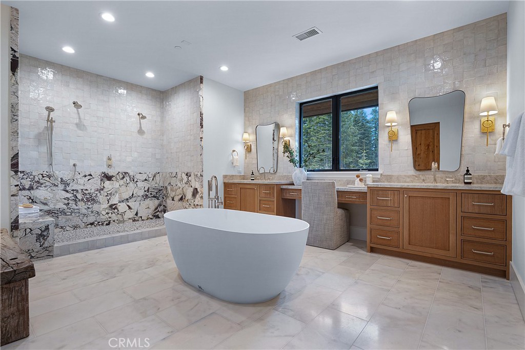 9348 Nine Bark Road Truckee, CA 96161 - Photo 18 of 58 a large spacious bathroom with a tub sink and mirror