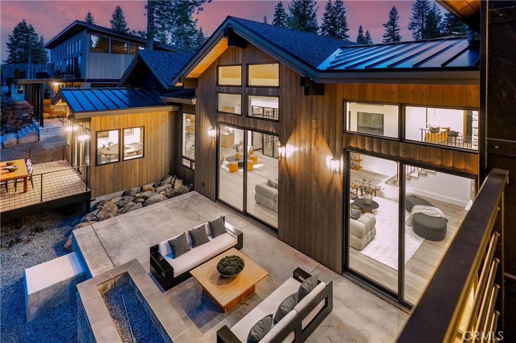 9348 Nine Bark Road Truckee, CA 96161 - Photo 2 of 58 a living room with furniture and a floor to ceiling window
