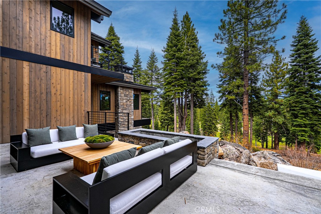 9348 Nine Bark Road Truckee, CA 96161 - Photo 24 of 58 a view of a patio with couches table and chairs and potted plants