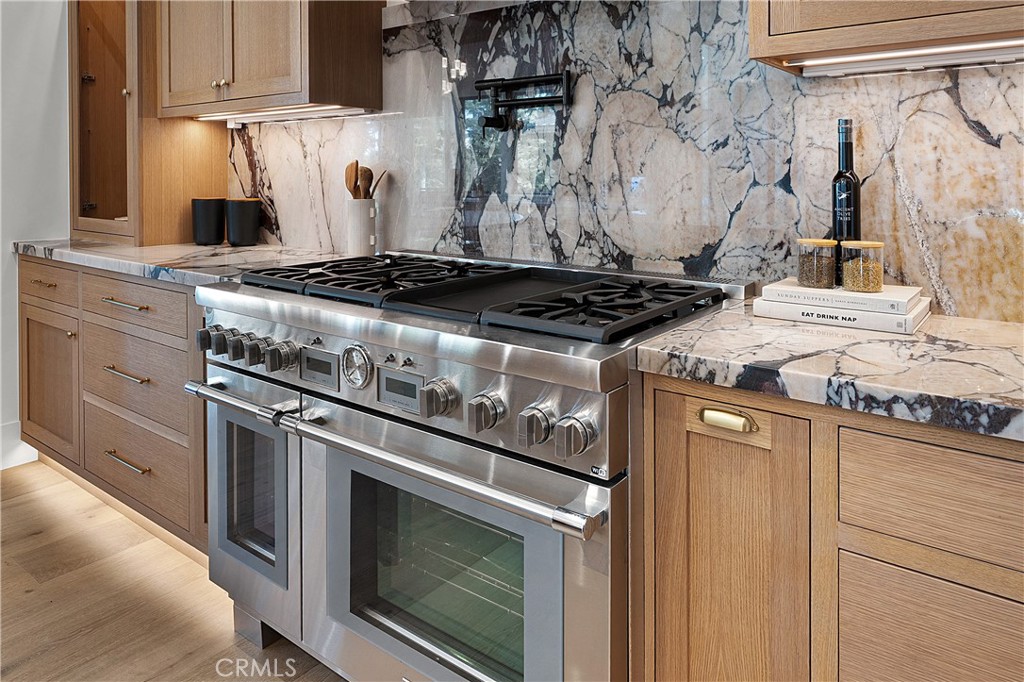 9348 Nine Bark Road Truckee, CA 96161 - Photo 27 of 58 a stove top oven sitting inside of a kitchen