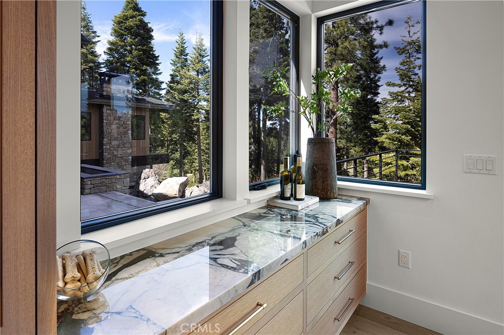 9348 Nine Bark Road Truckee, CA 96161 - Photo 38 of 58 a bathroom with a granite countertop sink and mirror