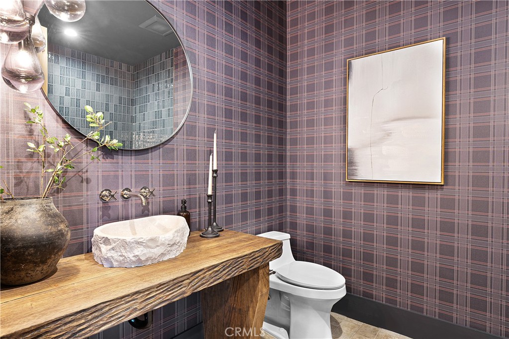 9348 Nine Bark Road Truckee, CA 96161 - Photo 45 of 58 a bathroom with a sink a toilet and a mirror