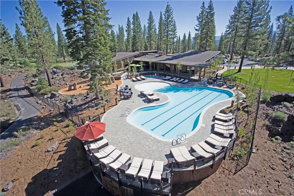 9348 Nine Bark Road Truckee, CA 96161 - Photo 54 of 58 a view of a patio with table and chairs with wooden floor and fence