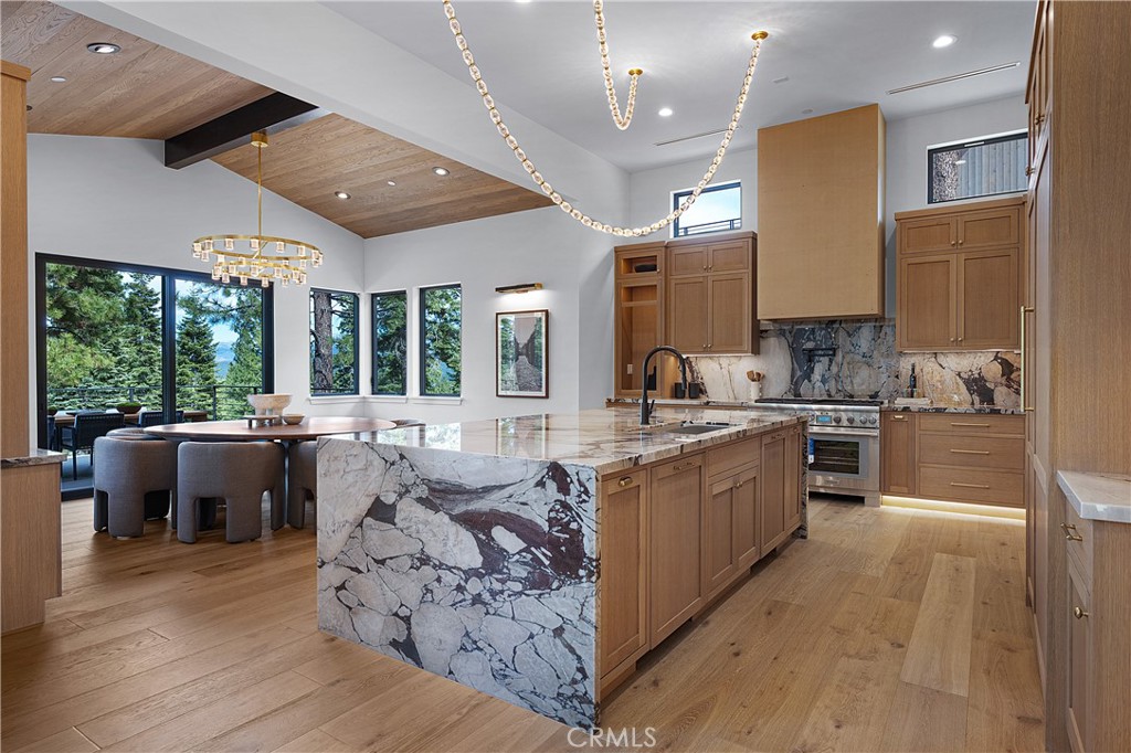 9348 Nine Bark Road Truckee, CA 96161 - Photo 7 of 58 a large kitchen with kitchen island wooden cabinets and stainless steel appliances