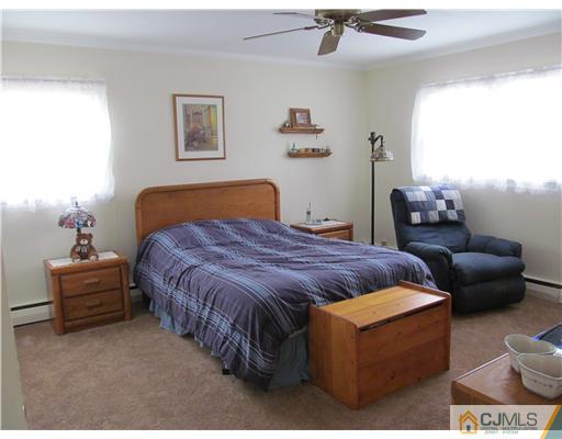 1 Timber Road East Brunswick, NJ 08816 - Photo 12 of 22 a bedroom with a bed and a couch
